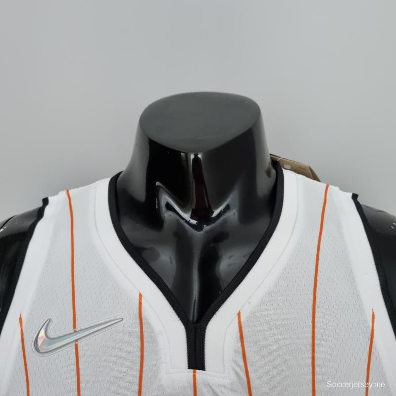 الذكرى 75 لقميص أورلاندو ماجيك أورلاندو ماغرادي ماجرادي رقم 1 باللونين الأبيض والبرتقالي في دوري كرة السلة الأمريكي للمحترفين
