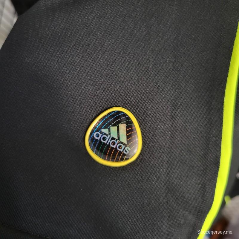 قميص كرة قدم ريترو 10-11 ريال مدريد ذهاباً وإياباً أسود بأكمام طويلة
