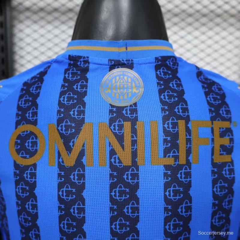 قميص اللاعب رقم 26/27 لفريق تشيفاس غوادالاخارا (قميص خارجي أزرق بنمط خطوط داكنة)