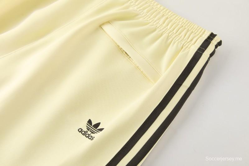2026  سترة بأزرار كاملة + بنطال طويل من Adidas بلون المشمش