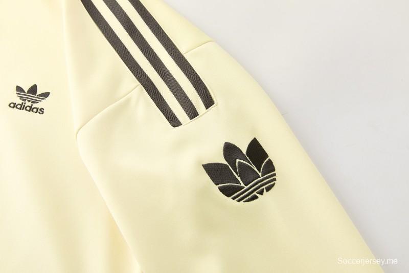 2026  سترة بأزرار كاملة + بنطال طويل من Adidas بلون المشمش