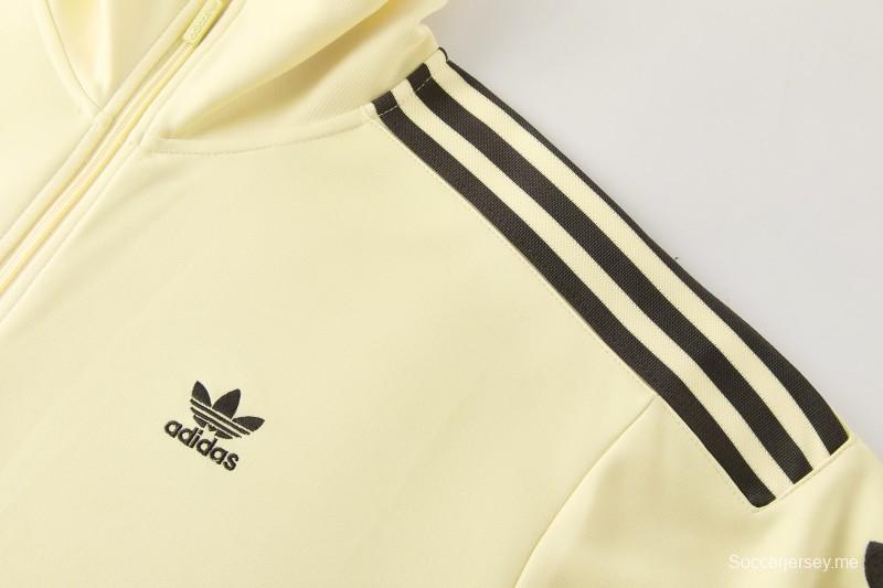 2026  سترة بأزرار كاملة + بنطال طويل من Adidas بلون المشمش
